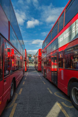 LONDON, ENGLAND - NOVEMBER 30, 2017: Red double deckers in central bus stop Stratford.のeditorial素材