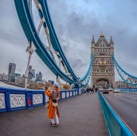 LONDON, ENGLAND - NOVEMBER 27, 2017: Wide angle view architecture from Tower Bridge with tourists and London over river Thames with skyscrapers.のeditorial素材