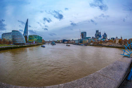 LONDON; ENGLAND - NOVEMBER 27; 2017: Panoramic view over London from the Tower Bridge to the City Hall; the Shard and other skyscrapers across the Thames.のeditorial素材