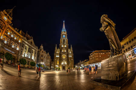 NOVI SAD, SERBIA-JULY 30,2017:Night view of the Liberty Square (Trg. Slobode) with Mary Church,statue,tourists and old buildings.One of the cities designated as the European capital of culture in 2021のeditorial素材