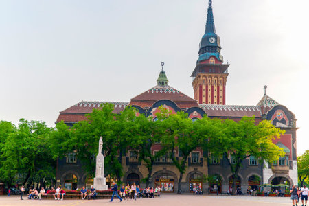 SUBOTICA/VOJVODINA, SERBIA - APRIL 28, 2018: Historic building of the City Hall built in Art Nouveau style between 1908-1910 and monument to the emperor Jovan Nenad. City is second town in the regionのeditorial素材