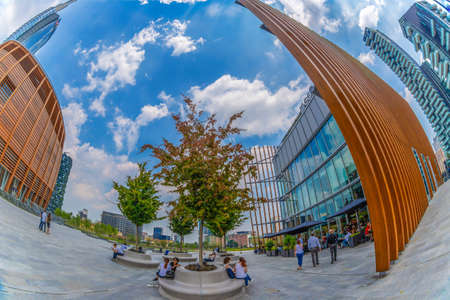 MILAN, ITALY - JULY 22,2018:Futuristic Unicredit Pavilion designed by Michele De Lucchi, Unicredit Bank Tower and buildings from Porta Nuova. Gae Aulenti square, financial district at Porta Garibaldi.のeditorial素材