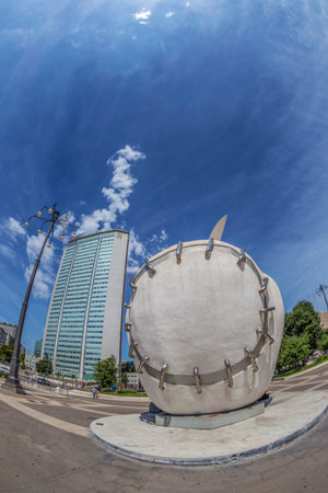 MILAN, ITALY - JUNE 22, 2018: The monumental sculpture ,,The Reintegrated Apple