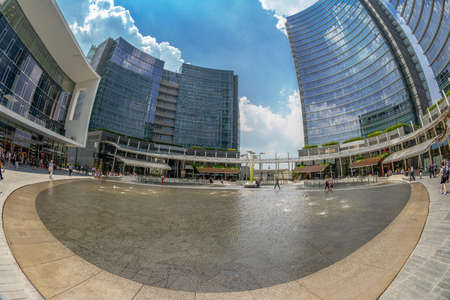 MILAN, ITALY - JUNE 22, 2018: Wide angle view of the new futuristic architecture buildings of Gae Aulenti square, financial district at Porta Garibaldi, in Porta Nuova district.のeditorial素材