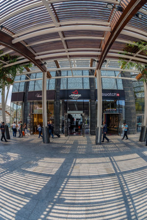 MILAN, ITALY - JUNE 22, 2018: Wide angle view of the luxury shops in futuristic architecture...