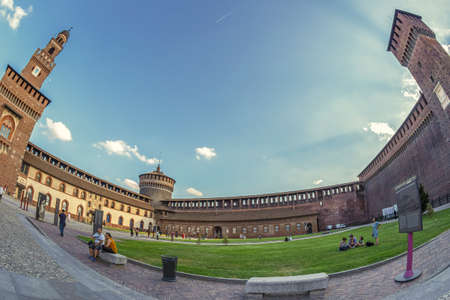 MILAN,ITALY-JUNE 22, 2018:Inside of the internal courtyard of Sforza Castle with tourists. The castle was built as from 1450 by Francesco I. Sforza, Duke of Milan. Also Leonardo Da Vinci worked there.のeditorial素材