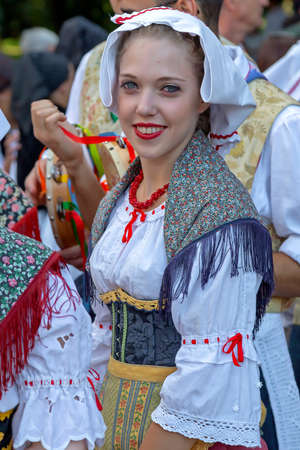 ROMANIA, TIMISOARA - JULY 5, 2018: Young woman from Italy in traditional costume, present at the international folk festival,のeditorial素材