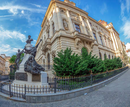 BUCHAREST, ROMANIA - JULY 16, 2018: The National Bank of Romania (NBR), set up in 1880, is from a chronological perspective, the sixteenth-central bank in the world. Statue of Eugeniu Carada in front.のeditorial素材