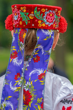 Detail of Ukrainian folk costume for woman with multi colored embroidery.