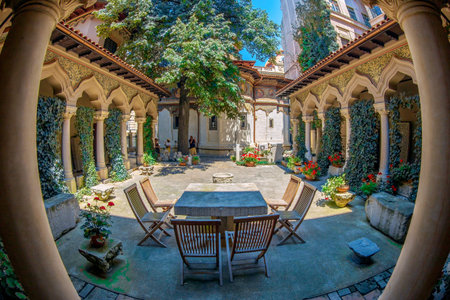 BUCHAREST, ROMANIA - JULY 16, 2018: The inner courtyard of Stavropoleos monastery, founded in 1724 by the Greek monk Ioanikia Stratonikeas, a masterpiece of Brancovan architectural style.のeditorial素材