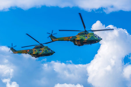 TIMISOARA, ROMANIA - JUNE 23, 2018: Helicopters doing demonstrations at one air show organized by...