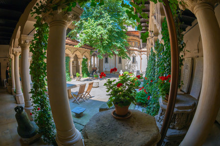 BUCHAREST, ROMANIA - JULY 16, 2018: The inner courtyard of Stavropoleos monastery, founded in 1724 by the Greek monk Ioanikia Stratonikeas, a masterpiece of Brancovan architectural style.のeditorial素材