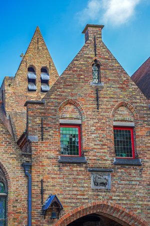 BRUGES, BELGIUM - OCTOBER 13, 2015: Architectural facade detail at old buildingas placed in Bruges, Belgium.のeditorial素材