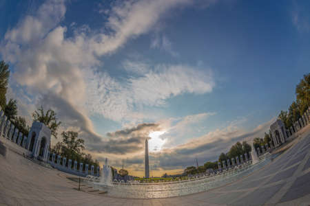 WASHINGTON DC, USA - AUGUST 31, 2018: World War Two Memorial. Large angle view of architecture to this famous and landmark monument with George Washington Memorial in background. Sunrise time.のeditorial素材