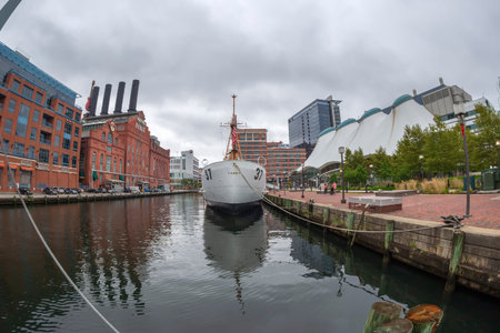 BALTIMORE, MARYLAND, USA - SEPTEMBER 8, 2018: Buildings and the USCGC Taney in the Inner Harbor. The...