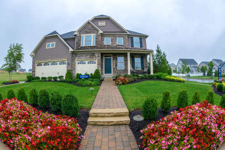 MARYLAND, USA - SEPTEMBER 10, 2018: Exterior of a house model exposed for sale in a community outside the city.のeditorial素材