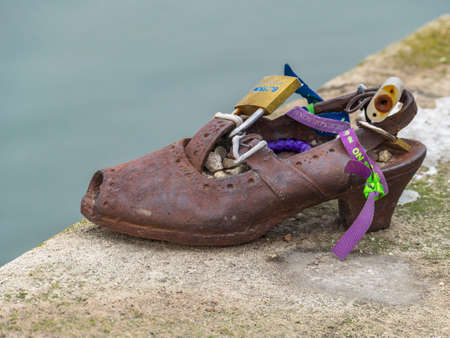 Budapest, Hungary - December 19, 2018: Shoes on the Danube shore are a monument created in memory of the Jews killed during the Second World War by the Arrow Cross Party soldier's between 1944-1945.のeditorial素材