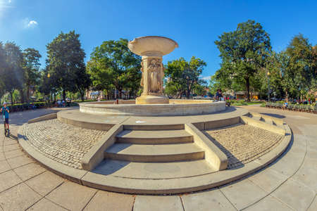 Washington DC, USA - September 2, 2018: People relaxing in front of Daniel Chester French's white marble fountain in the center of Dupont Circle, in afternoon light.のeditorial素材