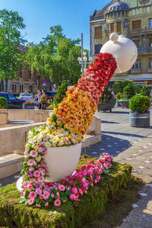 TIMISOARA, ROMANIA - APRIL 20, 2019: Beautiful floral decoration with the name âTea Time" in Victory Square on the occasion of the "Flower Festival" organized by the City Hall.のeditorial素材