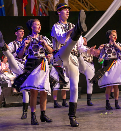 TIMISOARA, ROMANIA - JULY 7, 2016: Romanian dancers in traditional costume, perform at the...