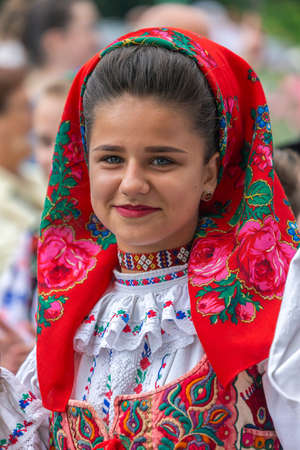 ROMANIA, TIMISOARA - JULY 4, 2017: Girl from Romania in traditional costume, present at the international folk festival, International Festival of hearts organized by the City Hall Timisoara.のeditorial素材