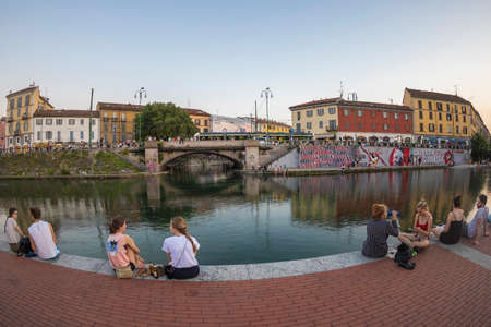 MILAN, ITALY - JUNE 29, 2019: Naviglio Grande, canal waterway which is the main nightlife place in Milan. Darsena area.のeditorial素材