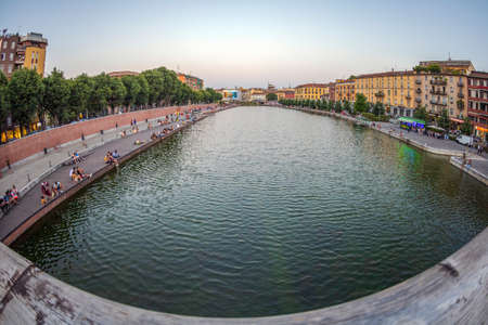 MILAN, ITALY - JUNE 29, 2019: Naviglio Grande, canal waterway which is the main nightlife place in Milan.のeditorial素材