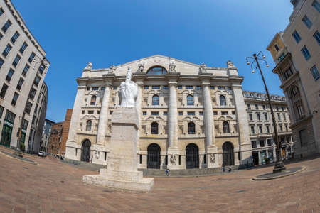 MILAN, ITALY - JUNE 29, 2019: The Palazzo Mezzanotte located in Piazza degli Affari,also called Palace of the Stock Exchange. In front is the statue L.O.V.E., created in 2010 by the Maurizio Cattelan.のeditorial素材