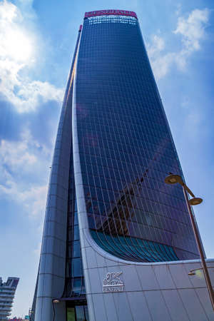 MILAN, ITALY - JUNE 28, 2019: Generali Tower by Zaha Hadid in City Life complex, Tre Torri Milan place. Modern buildings for Generali financial insurance companies.のeditorial素材