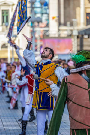 TIMISOARA, ROMANIA - SEPTEMBER 22, 2019: Italian artists called SBANDIERATORI, specialized in the art of throwing the flag, present at the Festival of Ethnic Minorities organized by the City Hall.のeditorial素材