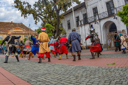 TIMISOARA,ROMANIA-SEPTEMBER 28,2019: Symbolic fighting on the street between Hungarian and Turkish soldiers symbolizing the siege of the city in 1552. Days of Hungarian culture organized by City Hall.のeditorial素材