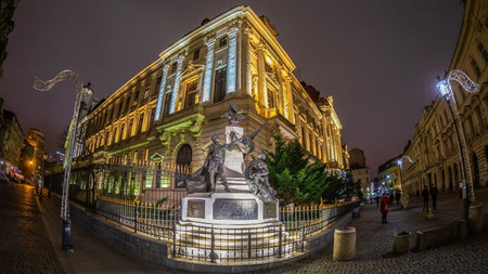 BUCHAREST,ROMANIA-NOVEMBER 26,2019: Night view of the National Bank of Romania. Set up in 1880, is...