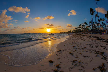 Sunset on a Dominican beach in Punta Cana. Fish ey view.の写真素材