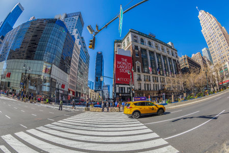 NEW YORK, MANHATTAN - MARCH 7, 2020: Buildings and traffic in Manhattan with typical yellow taxi...