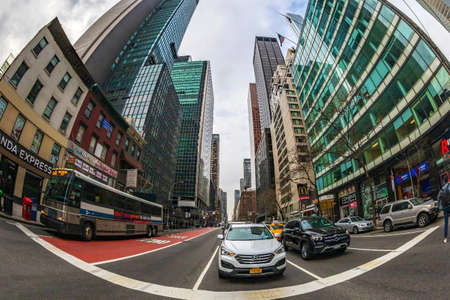 NEW YORK, MANHATTAN - MARCH 6, 2020: Buildings and traffic in Manhattan seen from the street level.のeditorial素材