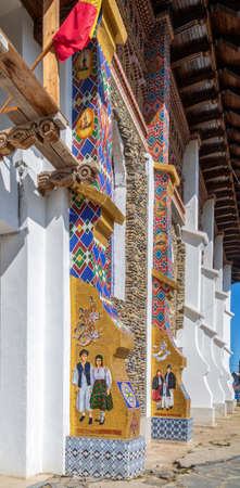 SAPANTA, MARAMURES, ROMANIA-SEPTEMBER 18, 2020: Church in the Merry Cemetery, famous in the world for its colorful wood tombstones, with naive paintings describing the people who are buried thereのeditorial素材