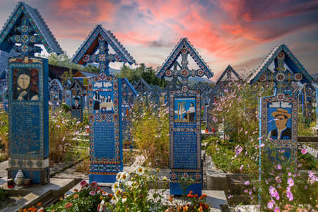 SAPANTA, MARAMURES, ROMANIA - SEPTEMBER 18, 2020: The Merry Cemetery, famous in the world for its colorful wood tombstones, with naive paintings describing the people who are buried there.のeditorial素材
