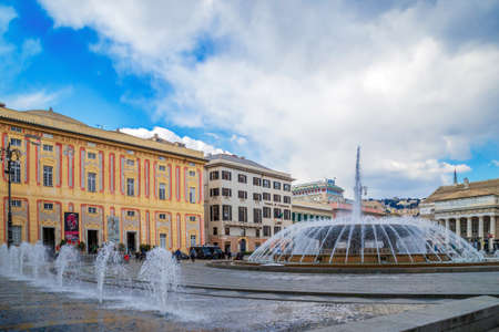 GENOA, ITALY - MARCH 20, 2021: Piazza Raffaele de Ferrari, the main square in Genoa, famous for its fountain and water games. In background Galleria San Lorenzo al Ducale.のeditorial素材