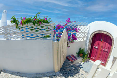 Typical traditional architecture with decorated houses in Oia, Santorini island, Greece.の写真素材