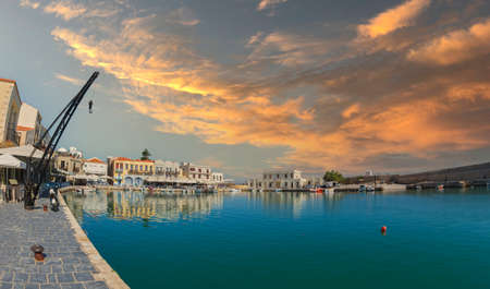 RETHYMNO, CRETE, GREECE - JUNE 18, 2021: The old harbor built by the Venetians in the 13th century, with the Egyptian lighthouse, small fishing boats and yachts, restaurants, taverns, bars and cafes.のeditorial素材
