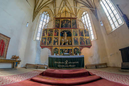 BIERTAN, ROMANIA-SEPT. 3, 2021: Interior of the fortified evangelical church built 1490-1520 The polyptych altar, with 28 painted panels, was made in 1483 and 1513 The pulpit carved in stone, from 1500.のeditorial素材