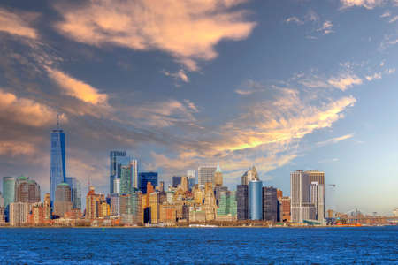 NEW YORK, USA - MARCH 9, 2020: View of the skyscrapers in Manhattan and Brooklyn bridge from the Hudson River in the afternoon light.のeditorial素材