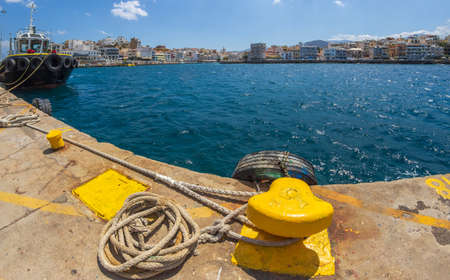 Agios Nikolaos, Crete, Greece-July 24, 2021: The Harbor of the town connected with Lake Voulismeni by a channel dug by the French army in 1907. According to legend, the goddess Athena bathed in lake.のeditorial素材