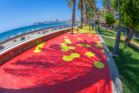 BENIDORM, COSTA BLANCA, SPAIN - AUGUST 13, 2020: Fisheye view with colored Benidorm beach promenade along the Playa de Poniente. Tourist resort.のeditorial素材