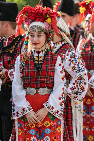 ROMANIA, TIMISOARA - JULY 7, 2022: Young girl from Bulgaria in traditional costume, present at the international folk festival, "International Festival of hearts" organized by the City Hall Timisoara.のeditorial素材