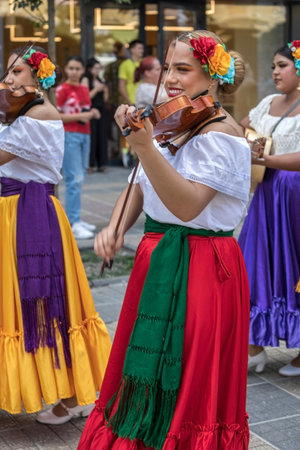 TIMISOARA, ROMANIA - JULY 7, 2022: Young Mexican singer on the violin in traditional costume, present at the international folk festival, "International Festival of hearts" organized by the City Hall.のeditorial素材