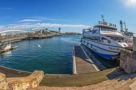 BARCELONA, CATALONIA, SPAIN - MARCH 1, 2022: Port Vell with Rambla de Mar, part of the Port of Barcelona.It was built as part of an urban renewal program prior to the 1992 Barcelona Olympics.のeditorial素材