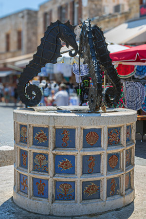 RHODES, GREECE - JUNE 30, 2022: The Sea Horse Fountain in Jewish Martyrs Square, old town of Rhodes, the oldest inhabited city in Europe with a history dating back 2400 years.のeditorial素材
