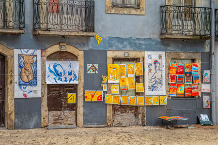 LISBON, PORTUGAL - APRIL 6, 2024: Exhibition with street sale of paintings, on ceramics painted in the local Azulejos technique and classic on paper and canvas.のeditorial素材