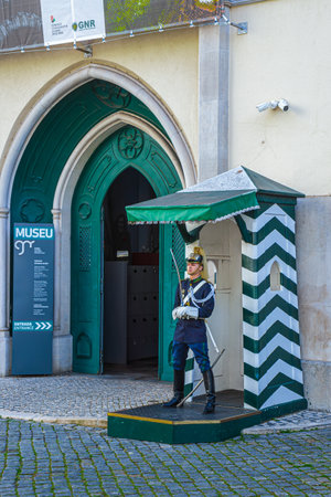 LISBON, PORTUGAL - APRIL 8, 2024: Portuguese soldier on guard at the entrance to The National Republican Guard Museum. The scene of important historical moments like the Carnation Revolution in 1974.のeditorial素材